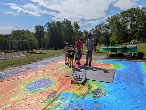The chassis driving on a huge printed map outdoors